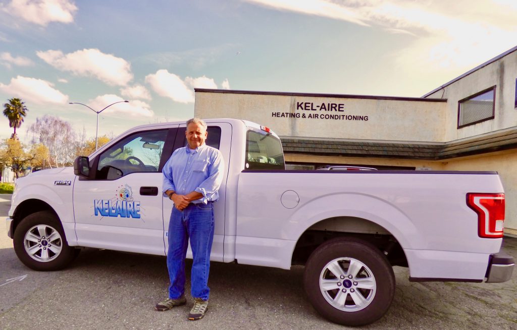 Man beside a pick-up truck